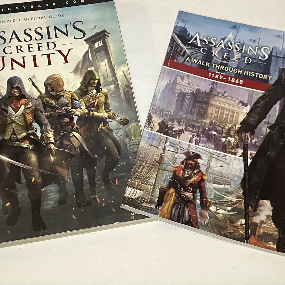 ASSASSINS CREED UNITY GUIDE & A WALK THROUGH HISTORY SET OF 2